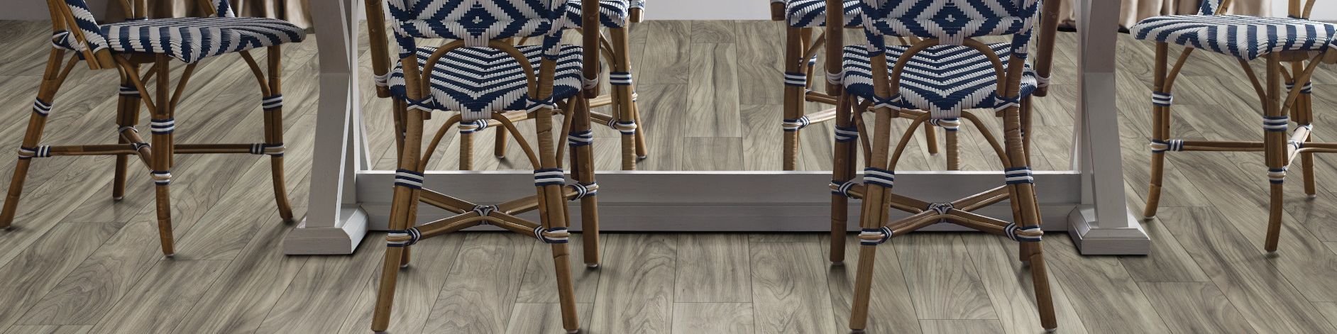 woven dining chairs around a dining table - Carpet and Tile Junction